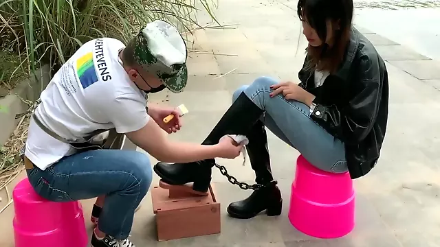 Chinese Cutie Shackled In Public