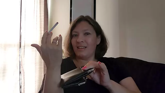 Big beautiful woman (BBW) uses leather cigarette case to give smoking fetish handjob