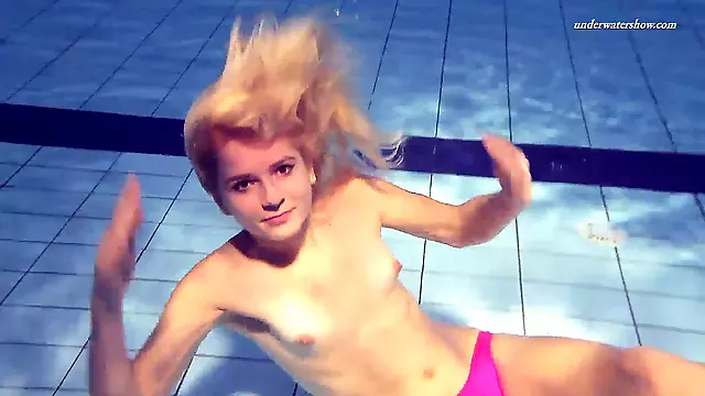 Held underwater, nudist yoga