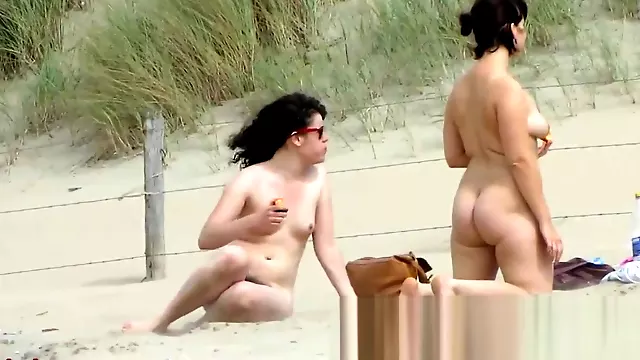 Chick on a nudist beach tanning and bending a nudist beach v